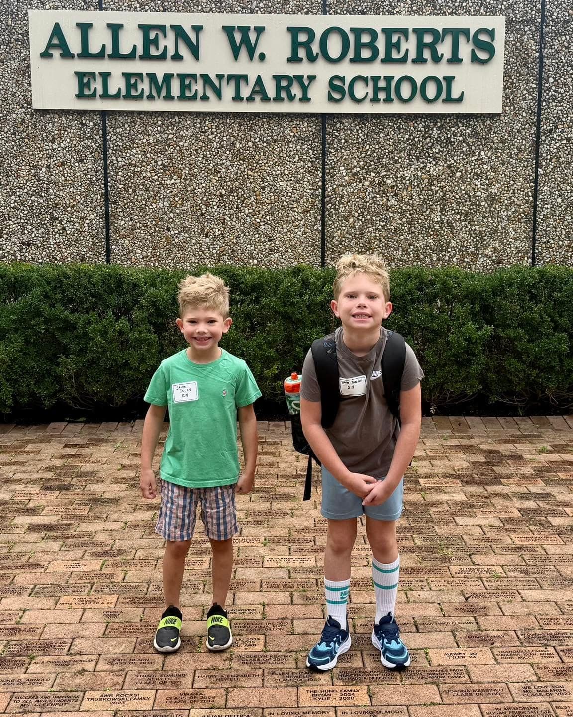 Young students arrive for the first day at Allen W. Roberts Elementary School.