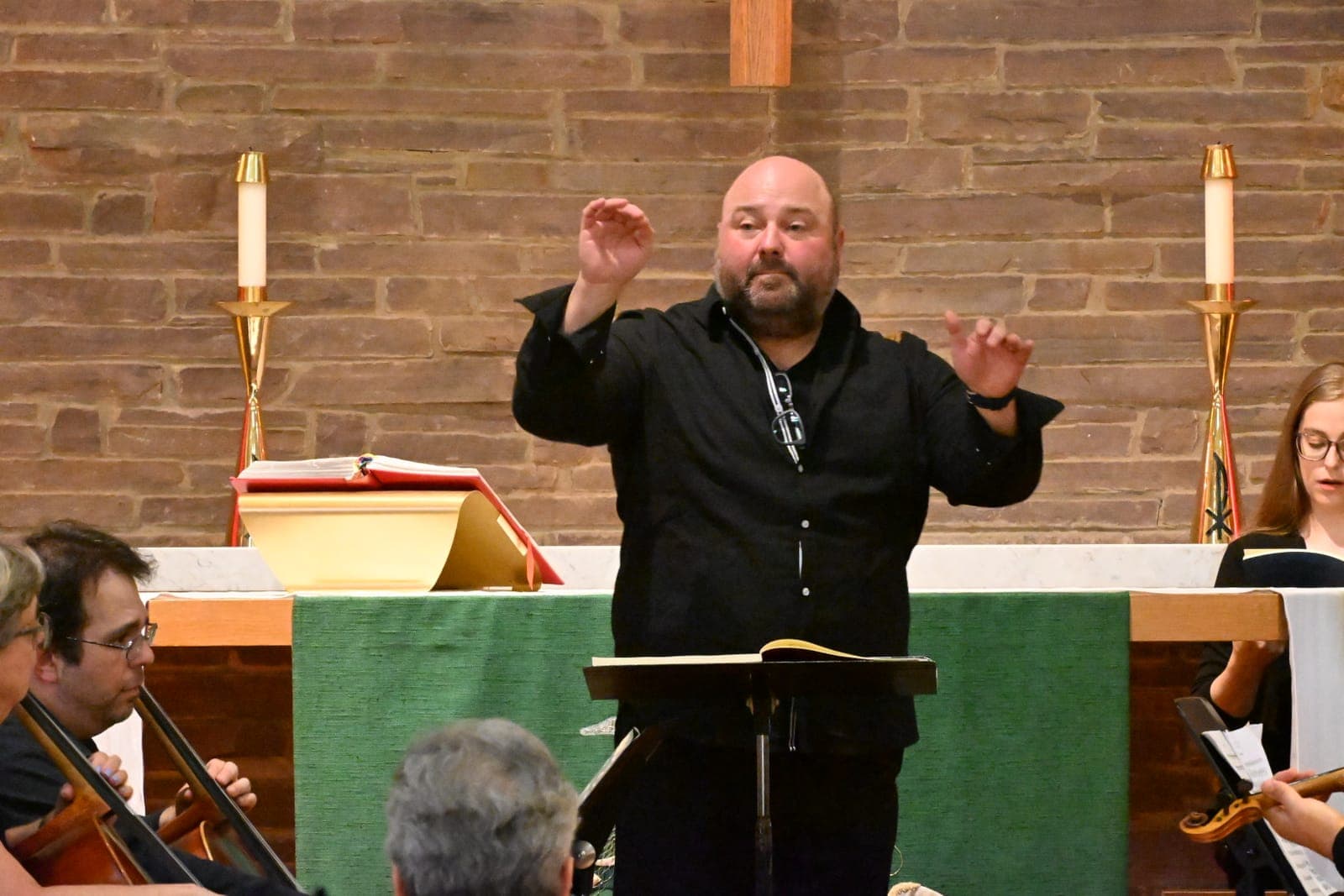 A conductor leads performers during the Summit Chorale's 9/11 Memorial Concert and Sing-In.