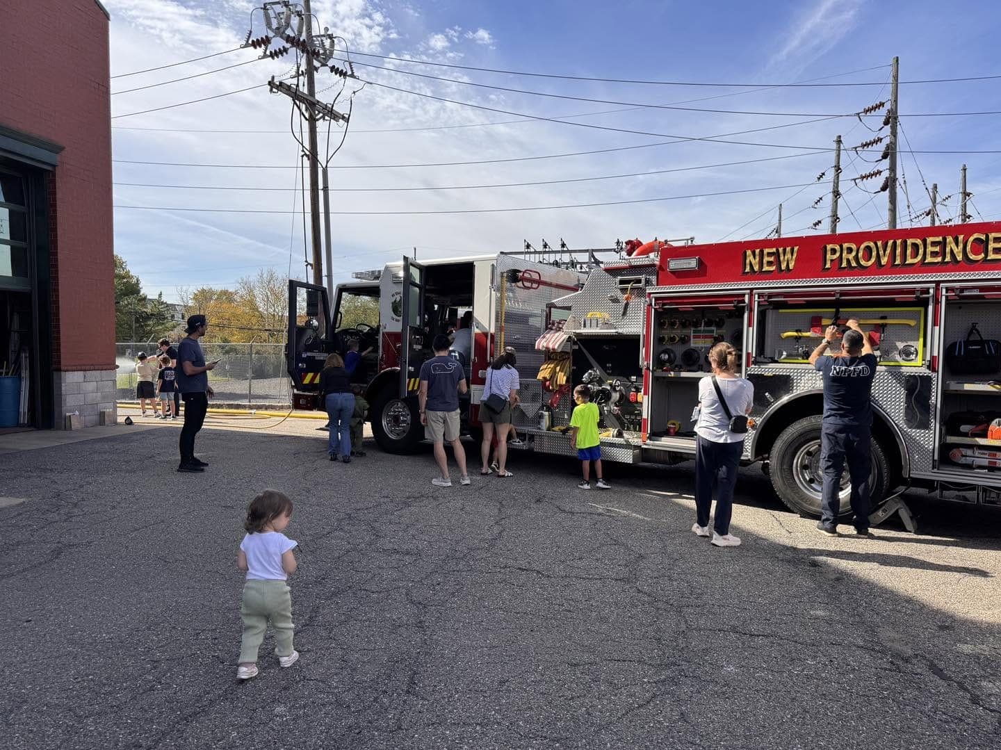 Families explore a New Providence fire engine at the open house.